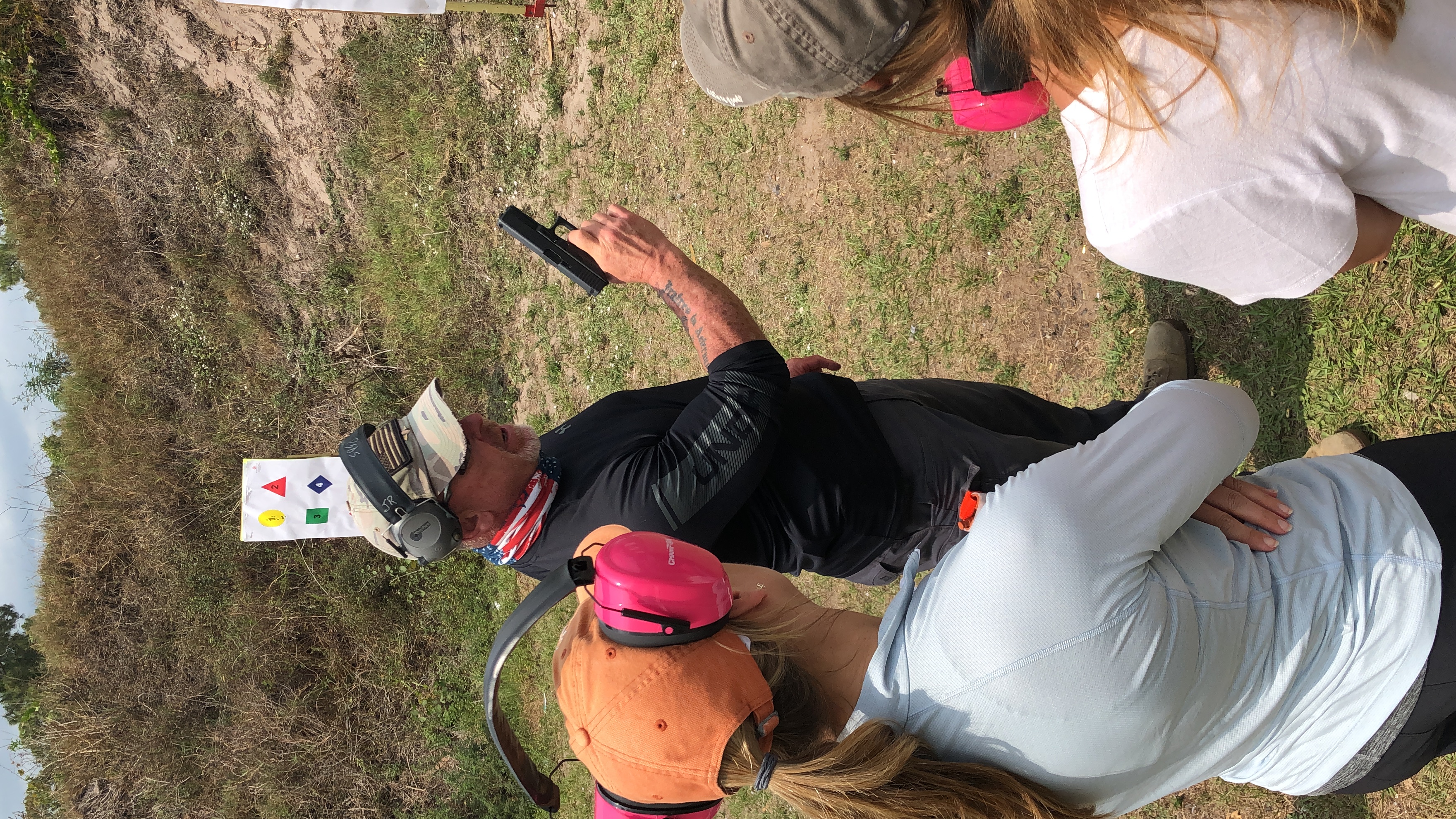 John P. Riddle coaching students through a firearms training drill