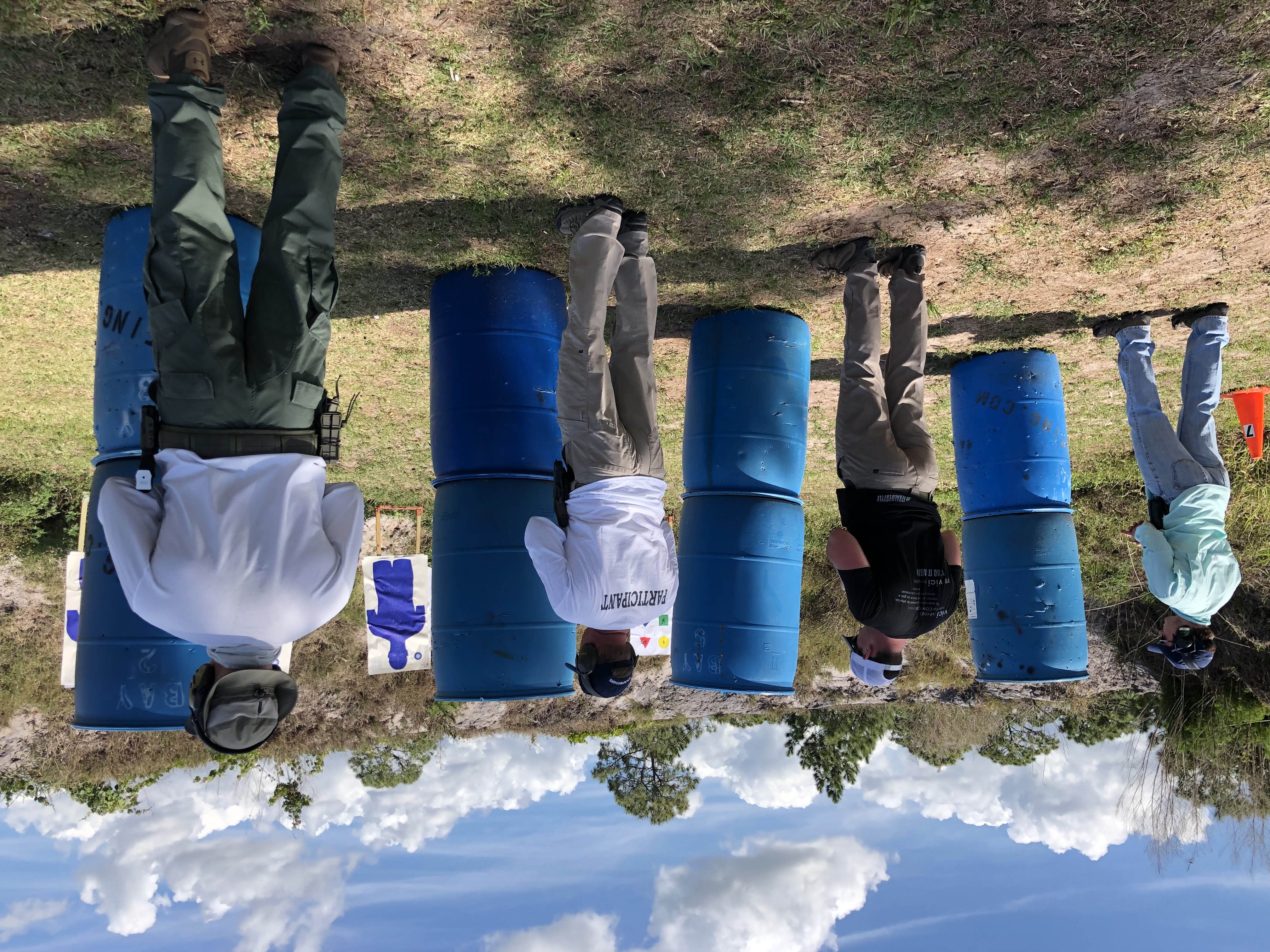 Students shooting side by side on the range during firearms training